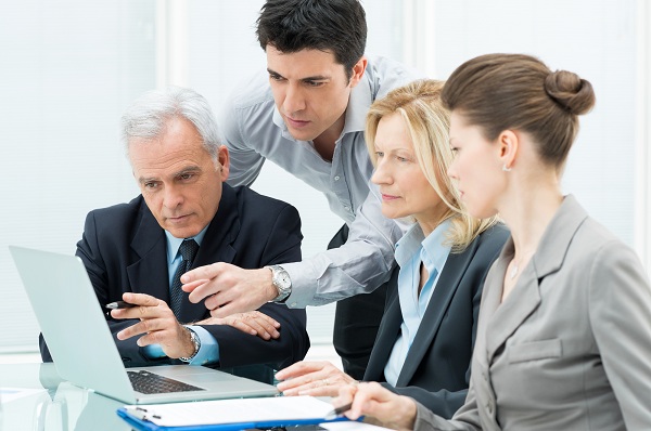 Team Of Business People Working Together On A Laptop SBAO – “La acreditación en las clínicas”
